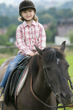 Girl riding horse